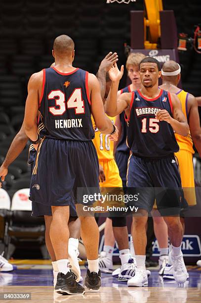 Richard Hendrix and Trey Johnson of the Bakersfield Jam slap hands during their game against the Los Angeles D-Fenders at Staples Center on December...