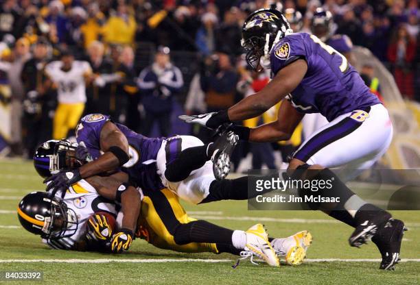 Santonio Holmes of the Pittsburgh Steelers makes a catch with both feet in the endzone for a late fourth quarter game winning touchdown as Ed Reed of...