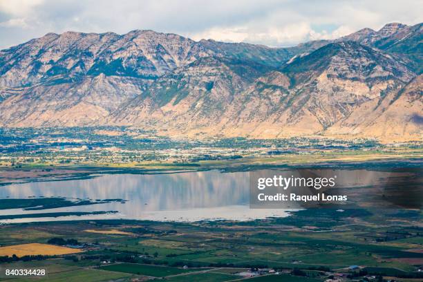 aerial view of mountains, lake, and town - provo foto e immagini stock