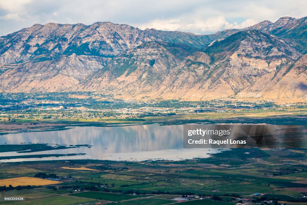 Aerial view of mountains, lake, and town
