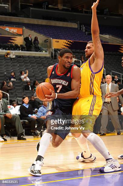 Derrick Byars of the Bakersfield Jam handles the ball against Curtis Terry of the Los Angeles D-Fenders at Staples Center on December 14, 2008 in Los...