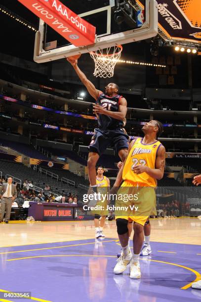 DeMarcus Nelson of the Bakersfield Jam goes up for a layup against Marcus White of the Los Angeles D-Fenders at Staples Center on December 14, 2008...