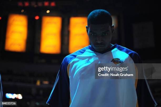 Andrew Bynum of the Los Angeles Laker stands during the singing of the National Anthem prior to the game against the Minnesota Timberwolves at...