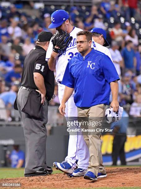 Kansas City Royals relief pitcher Brian Flynn leaves the game with an injury in the sixth inning during Monday's baseball game against the Tampa Bay...