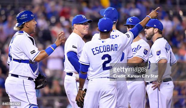 Kansas City Royals manager Ned Yost waits with the infield for relief pitcher Scott Alexander after relief pitcher Brian Flynn left the game in the...
