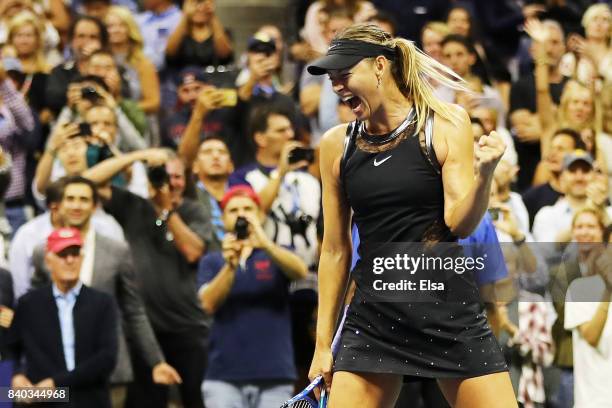 Maria Sharapova of Russia celebrates winning her first round Women's Singles match against Simona Halep of Romania on Day One of the 2017 US Open at...