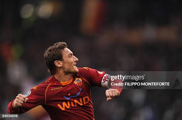 Roma's forward Francesco Totti celebates after scoring against Cagliari during their Italian Serie A football match at Rome's Olympic Stadium on...