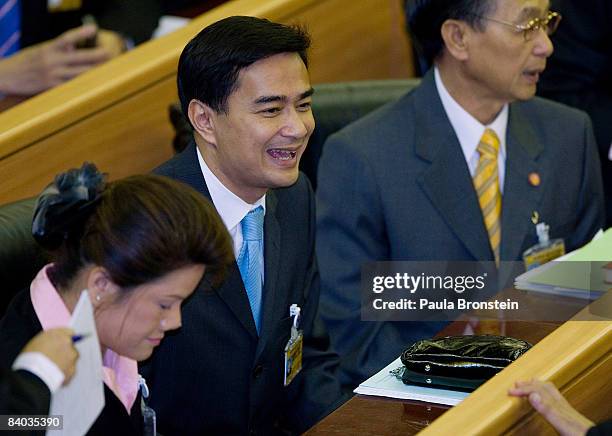 Thai opposition leader Abhisit Vejjajiva greets members of parliament after he won the vote to become Thailand's prime minister on December 15, 2008...