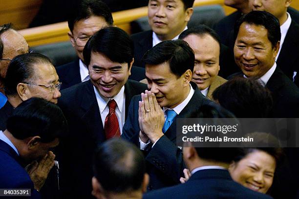 Thai opposition leader Abhisit Vejjajiva greets members of parliament after he won the vote to become Thailand's prime minister on December 15, 2008...