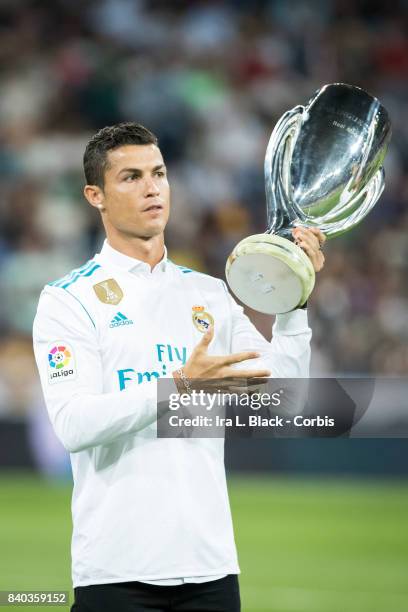 August 27: Cristiano Ronaldo of Real Madrid holds up the UEFA Super Cup trophy prior to the La Liga match between Real Madrid and Valencia C.F. At...