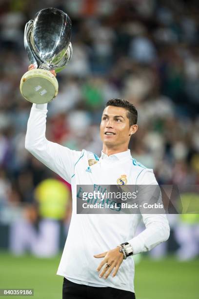 August 27: Cristiano Ronaldo of Real Madrid holds up the UEFA Super Cup trophy prior to the La Liga match between Real Madrid and Valencia C.F. At...