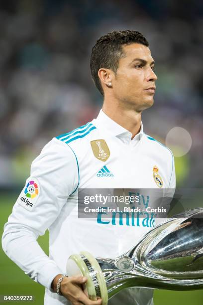 August 27: Cristiano Ronaldo of Real Madrid holds the UEFA Super Cup trophy prior to the La Liga match between Real Madrid and Valencia C.F. At the...