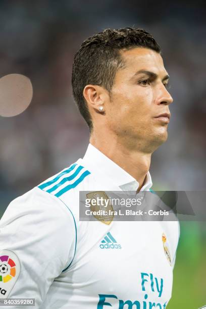 August 27: Cristiano Ronaldo of Real Madrid holds the UEFA Super Cup trophy prior to the La Liga match between Real Madrid and Valencia C.F. At the...