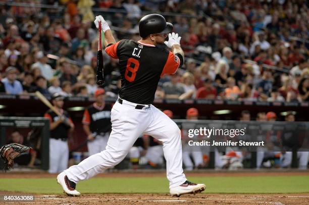 Chris Iannetta of the Arizona Diamondbacks wearing a nickname-bearing jersey swings at a pitch in the game against the San Francisco Giants at Chase...