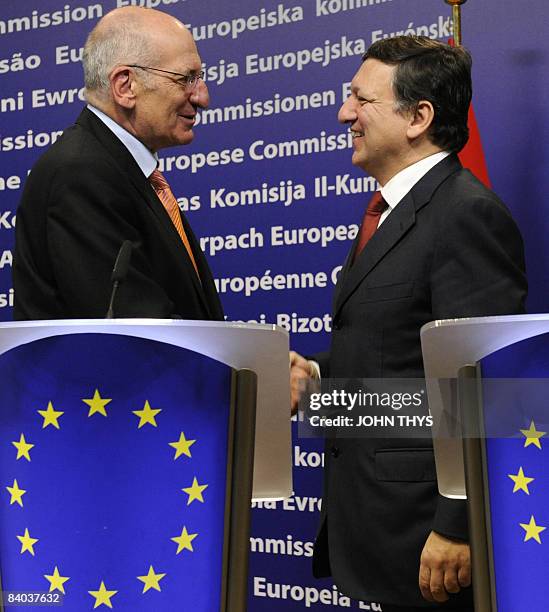 European Commission President Jose Manuel Barroso and Swiss President Pascal Couchepin shake hands after their joint press at the EU headquarters in...