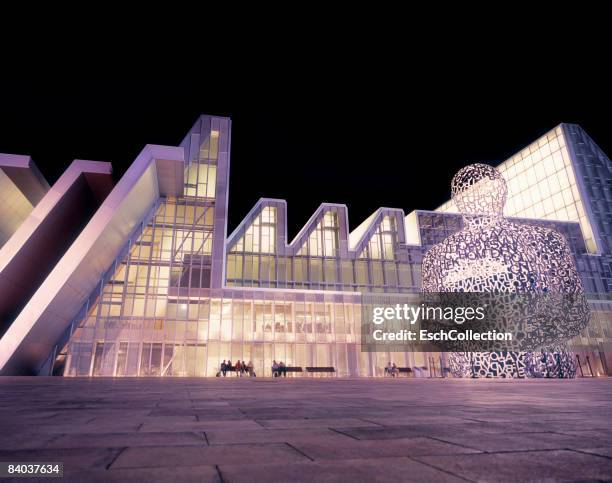 evening image of the congress center in zaragoza. - jaume plensa stock pictures, royalty-free photos & images