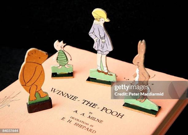 Rare American first edition of a Winnie-the-Pooh book signed by the author A.A. Milne and illustrator E.H Shephard is displayed with Pooh characters...