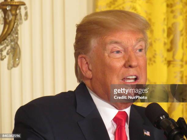 President Donald Trump answers a question during a joint press conference with Finnish President Sauli Niinistö holds on August 28 at the White House...