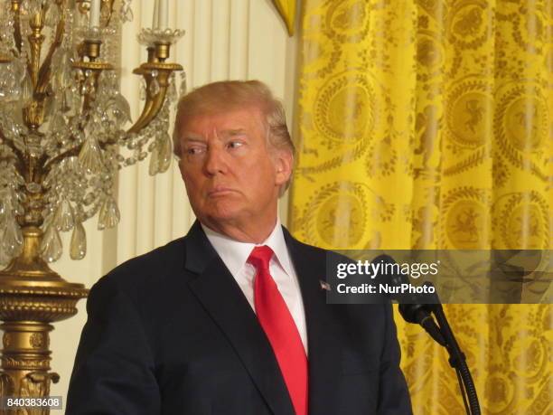 President Donald Trump answers a question during a joint press conference with Finnish President Sauli Niinistö holds on August 28 at the White House...