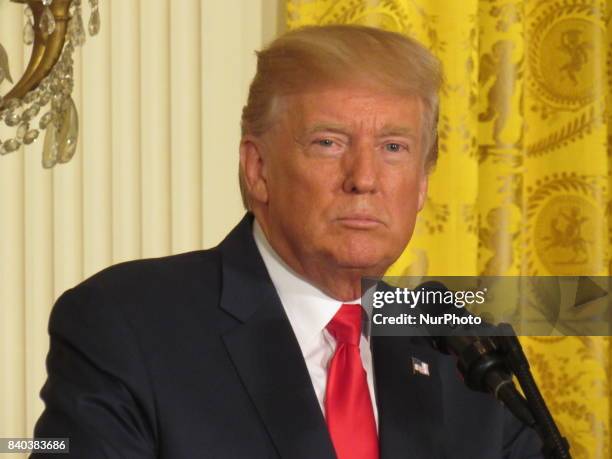 President Donald Trump answers a question during a joint press conference with Finnish President Sauli Niinistö holds on August 28 at the White House...