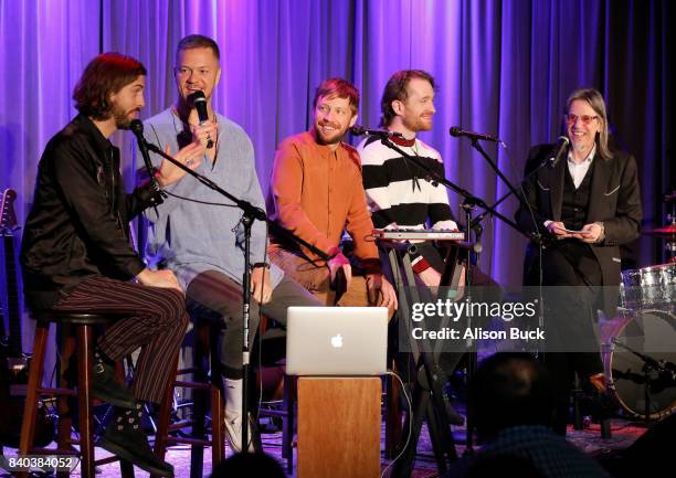 Rock Band Imagine Dragons and Vice President of The GRAMMY Foundation & MusiCares Scott Goldman speak onstage during The Drop: Imagine Dragons at The...