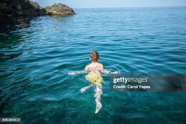 happy boy swimming in sea