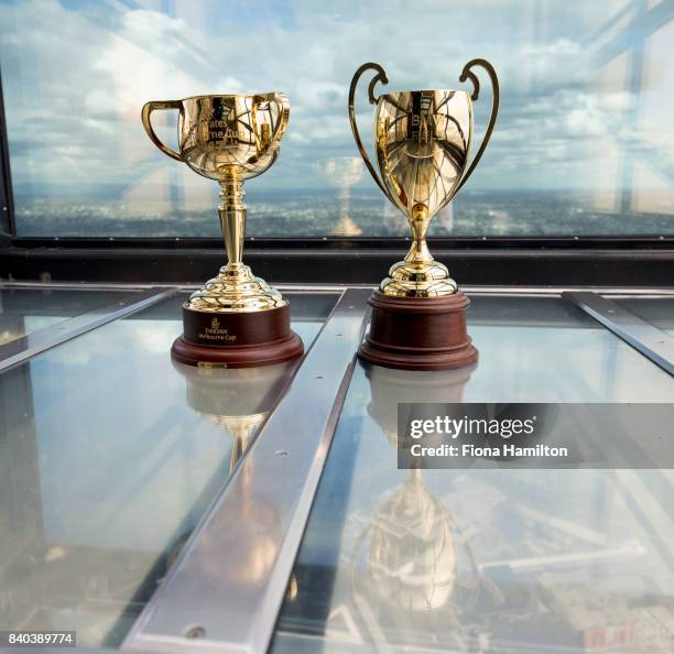 Emirates Melbourne Cup trophy and the 2017 BMW Caulfield Cup trophy at Eureka Tower on August 29, 2017 in Melbourne, Australia.