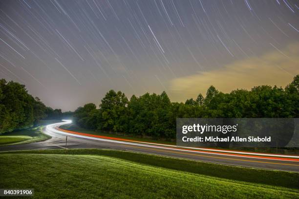 star trail with headlight trail - natchez trace parkway stock pictures, royalty-free photos & images