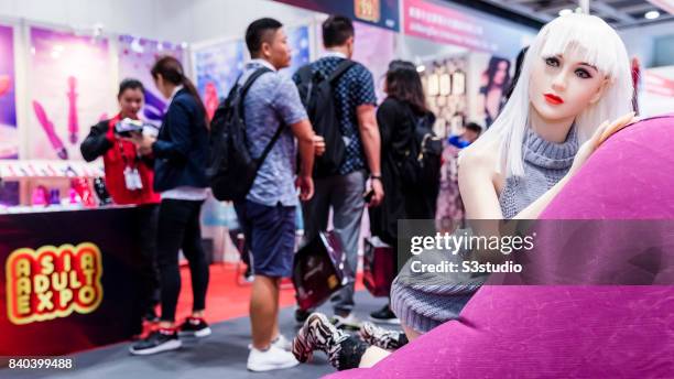 Visitors pass by the silicon made sex doll during the Asia Adult Expo 2017 at the Hong Kong Convention and Exhibition Centre on 29 August 2017 in...