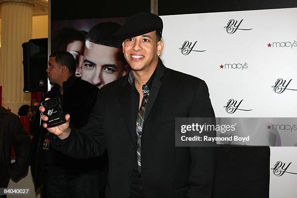 Latin rapper Daddy Yankee poses with his new fragrance, "DY", at Macy's on State Street in Chicago, Illinois on December 12, 2008.