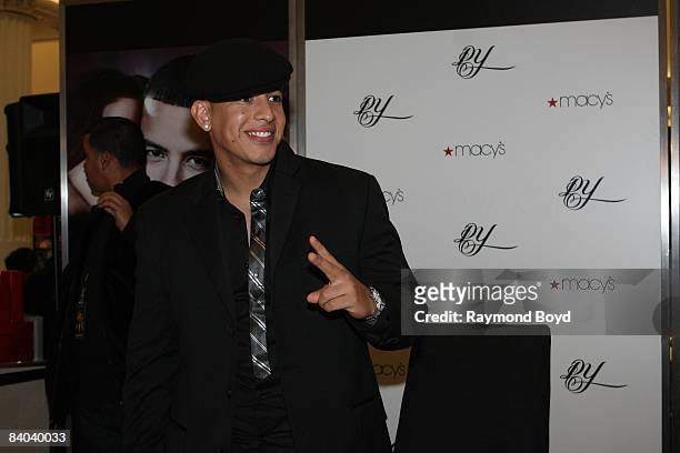 Latin rapper Daddy Yankee poses for photos while introducing his new fragrance, "DY", at Macy's on State Street in Chicago, Illinois on December 12,...