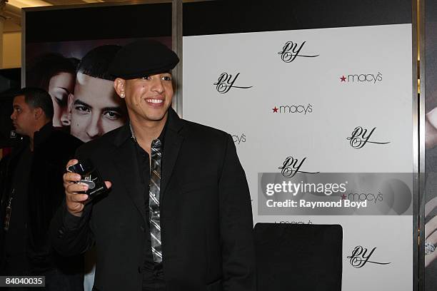 Latin rapper Daddy Yankee poses with his new fragrance, "DY", at Macy's on State Street in Chicago, Illinois on December 12, 2008.