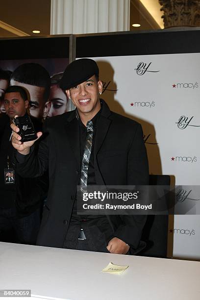 Latin rapper Daddy Yankee poses with his new fragrance, "DY", at Macy's on State Street in Chicago, Illinois on December 12, 2008.