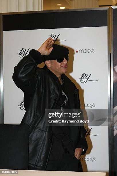 Latin rapper Daddy Yankee acknowledges his fans while introducing his new fragrance, "DY", at Macy's on State Street in Chicago, Illinois on December...