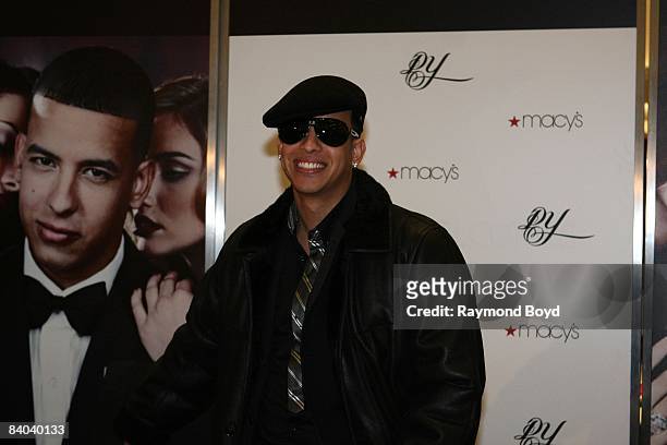 Latin rapper Daddy Yankee poses for photos while introducing his new fragrance, "DY", at Macy's on State Street in Chicago, Illinois on December 12,...