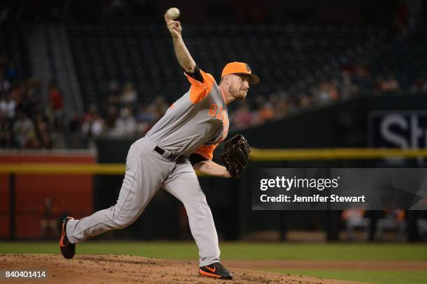 Chris Stratton of the San Francisco Giants delivers a pitch in the first inning against the Arizona Diamondbacks at Chase Field on August 27, 2017 in...