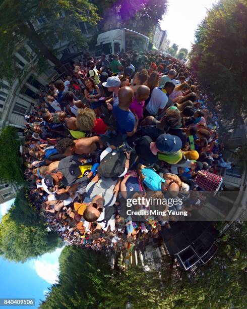 Little planet view of carnival crowds in the streets during Notting Hill Carnival on August 27, 2017 in London, England.