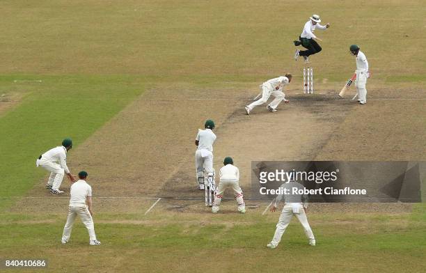 Nathan Lyon of Australia runs-out Mushfiqur Rahim of Bangladesh during day three of the First Test match between Bangladesh and Australia at Shere...