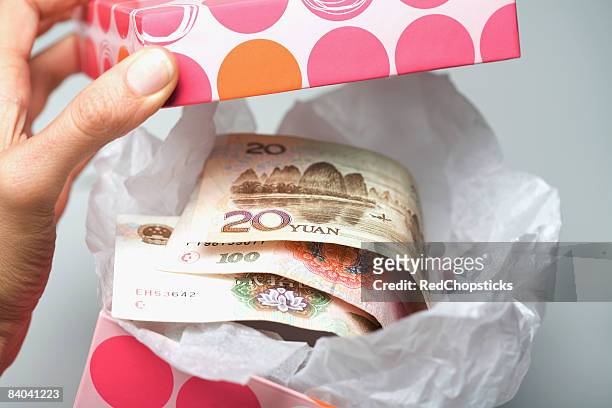 chinese yuan notes in a container - 20 yuan note stock pictures, royalty-free photos & images