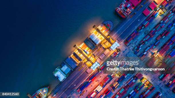 container ship in import export and business logistics, by crane, trade port, shipping cargo to harbor - container stock pictures, royalty-free photos & images