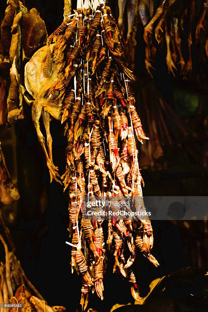 Chickens hanging at a market stall, Hefei, Anhui Province, China
