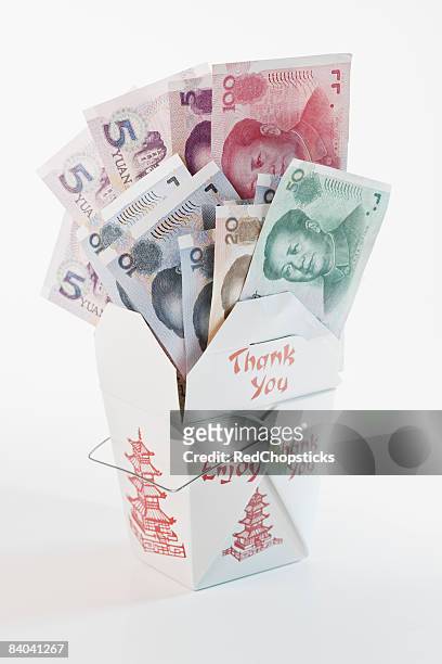 close-up of chinese paper currency in a chinese takeout box - 20 yuan note stock pictures, royalty-free photos & images