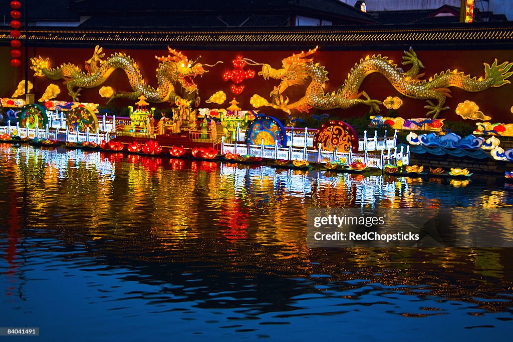 Chinese dragon sculptures lit up at night, Nanjing, Jiangsu Province, China