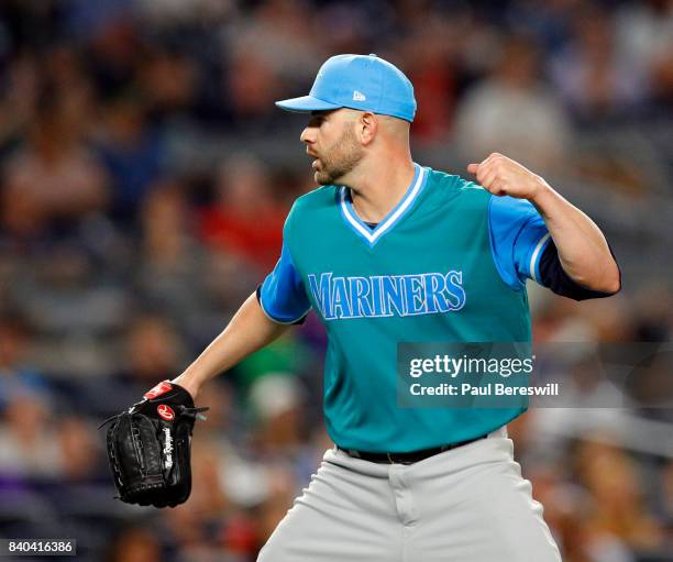 Pitcher Marc Rzepczynski of the Seattle Mariners reacts to getting an out to end the inning in an MLB baseball game against the New York Yankees on...