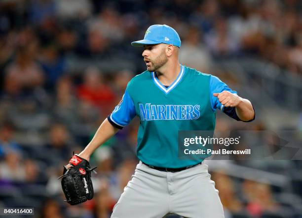 Pitcher Marc Rzepczynski of the Seattle Mariners reacts to getting an out to end the inning in an MLB baseball game against the New York Yankees on...