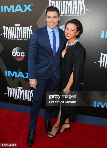 Anson Mount and Darah Trang attend the world premiere of "Inhumans" at Universal CityWalk on August 28, 2017 in Universal City California.
