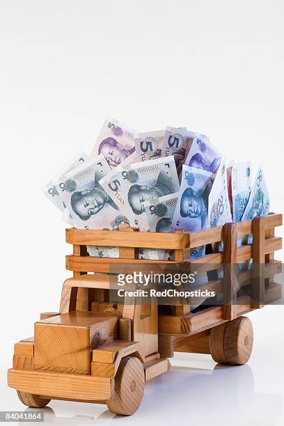 chinese yuan notes loaded into a toy truck - 20 yuan note stock pictures, royalty-free photos & images