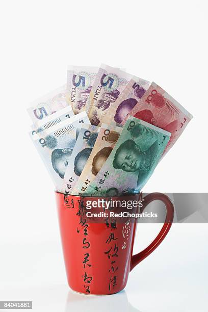 close-up of chinese currency in a cup - 20 yuan note stock pictures, royalty-free photos & images
