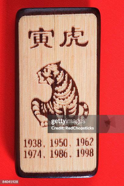 carved bamboo thing with tiger representing birth years - 1974 stock pictures, royalty-free photos & images