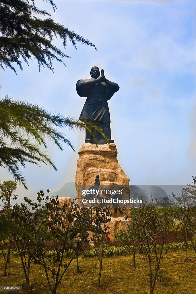 Low angle view of a statue of a monk, Songyang Academy, Shaolin Monastery, Henan Province, China